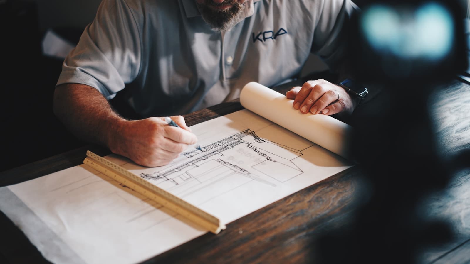 Construction plans being drawn by hand