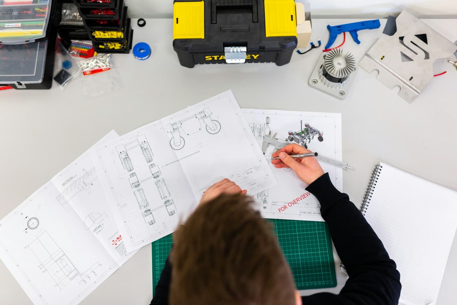 Engineer working over technical drawings